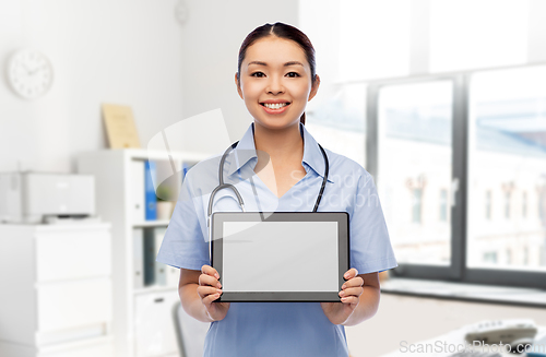 Image of asian female doctor with tablet pc at hospital