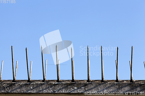 Image of old fence spikes