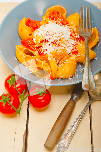 Image of Italian snail lumaconi pasta with tomatoes