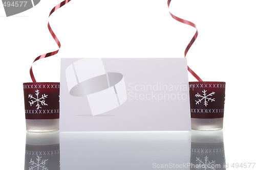 Image of christmas candles holding a blank card 