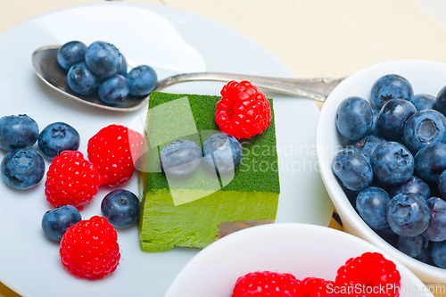 Image of green tea matcha mousse cake with berries