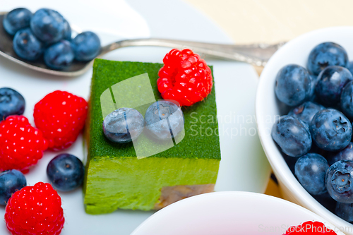 Image of green tea matcha mousse cake with berries