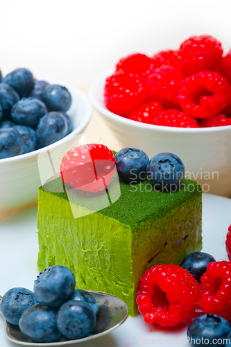 Image of green tea matcha mousse cake with berries