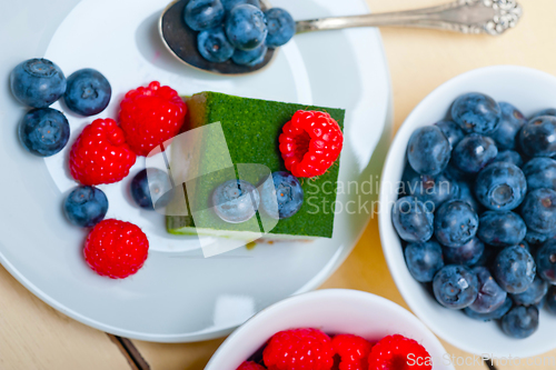 Image of green tea matcha mousse cake with berries