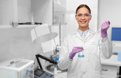 Image of female scientist with chemical at laboratory