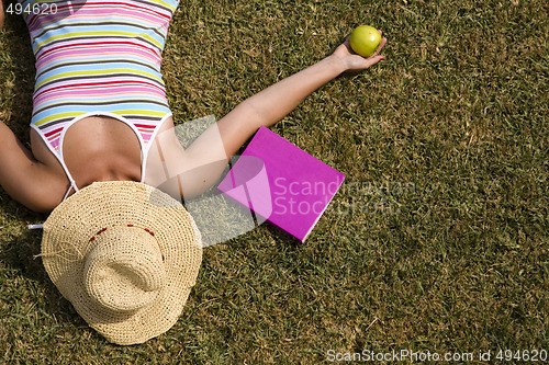 Image of student at the grass
