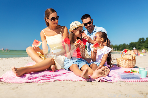 Image of happy family having picnic on summer beach