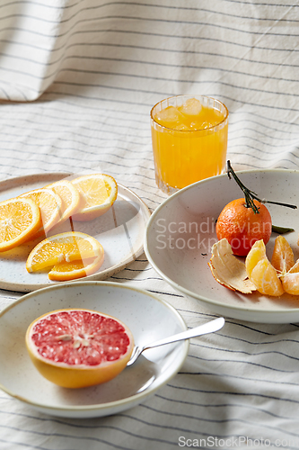 Image of mandarin, grapefruit and glass of orange juice