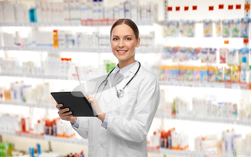 Image of happy female doctor with tablet pc and stethoscope