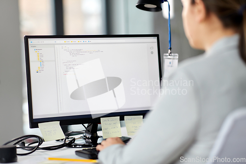 Image of businesswoman with computer working at office