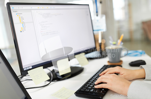 Image of businesswoman with computer working at office