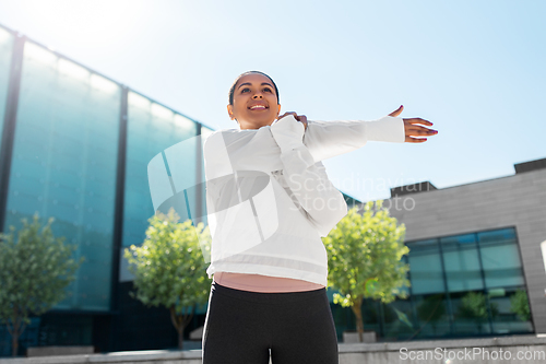 Image of african american woman doing sports outdoors