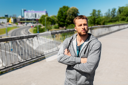 Image of portrait of young man outdoors