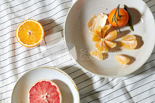 Image of still life with mandarins and grapefruit on plate