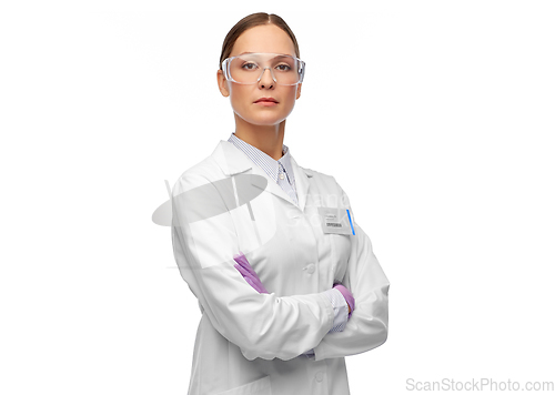 Image of female scientist in goggles and gloves
