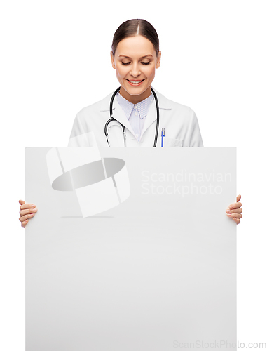 Image of happy smiling female doctor holding white board