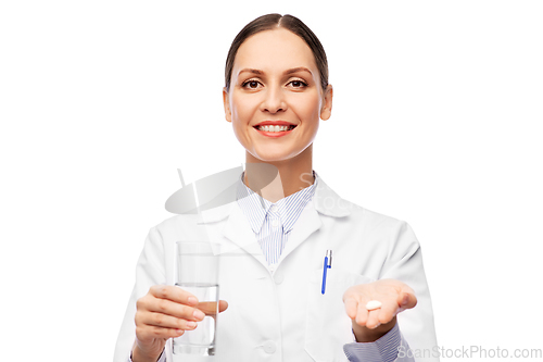 Image of female doctor with medicine and glass of water