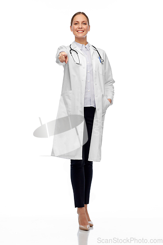 Image of happy female doctor pointing to you