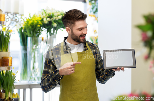 Image of happy male gardener or farmer with tablet pc