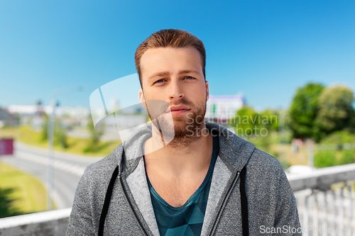 Image of portrait of young man outdoors