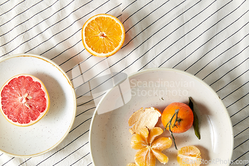 Image of still life with mandarins and grapefruit on plate