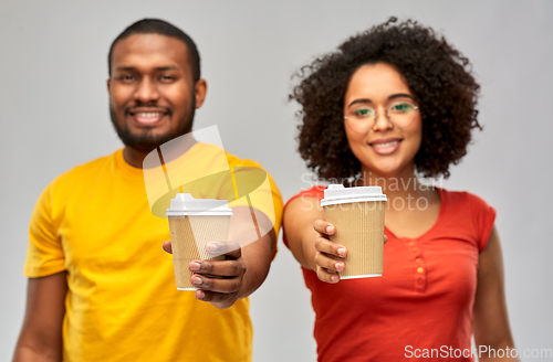 Image of happy african american couple with coffee cups