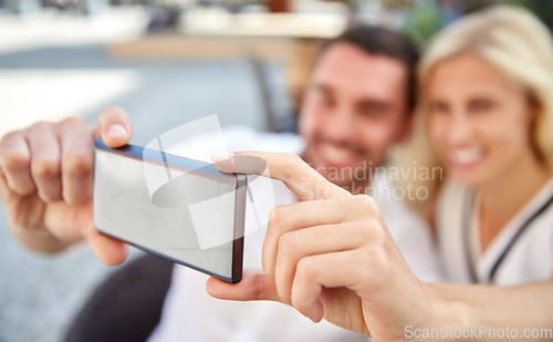 Image of happy couple taking selfie with smatphone at cafe