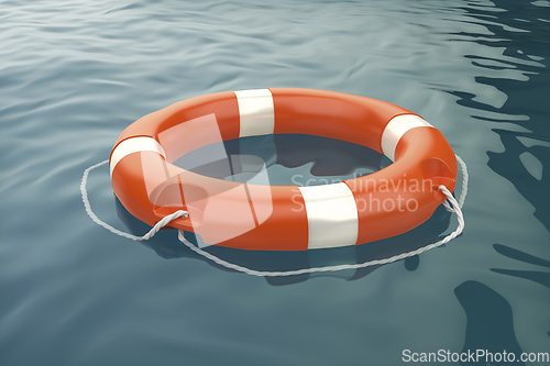 Image of Orange lifebuoy ring in the ocean