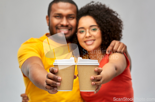 Image of happy african american couple with coffee cups