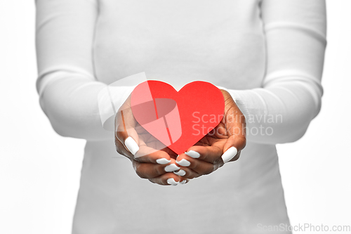 Image of close up of african american woman with red heart