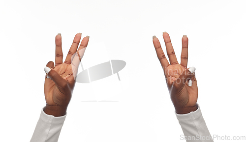 Image of african american woman showing six fingers