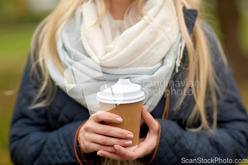 Image of close up of young woman drinking takeaway coffee