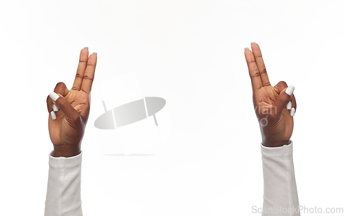 Image of hands of african american woman showing fingers