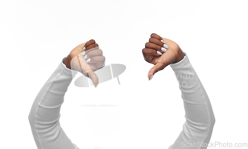 Image of hands of african american woman with thumbs down