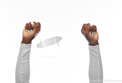 Image of hands of african american woman showing fists