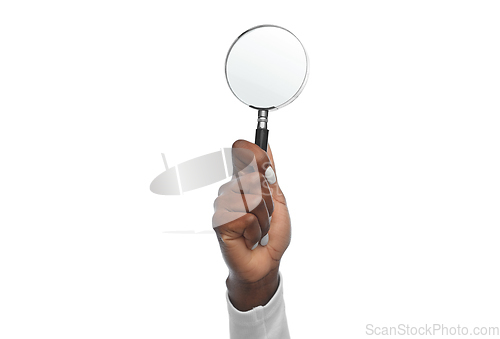 Image of hand with magnifying glass