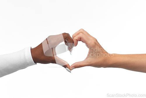 Image of black and white hands making heart gesture