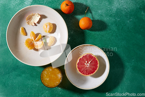 Image of mandarins, grapefruit and glass of juice