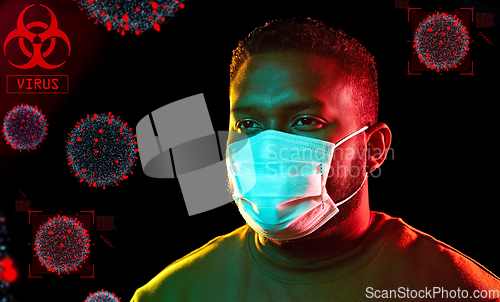 Image of african american man wearing medical mask