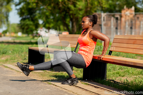 Image of african american woman doing sports outdoors