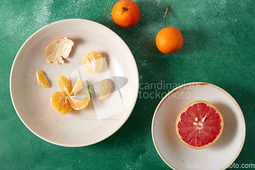 Image of mandarins, grapefruit and glass of juice