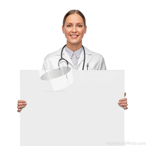 Image of happy smiling female doctor holding white board