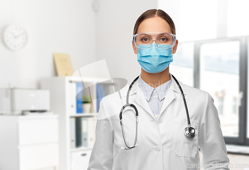 Image of female doctor in goggles and mask at hospital