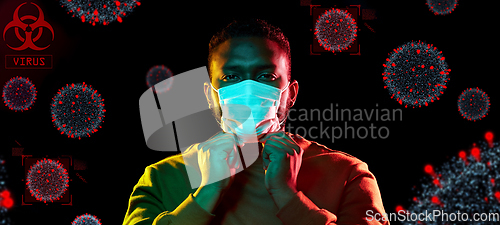 Image of african american man wearing medical mask