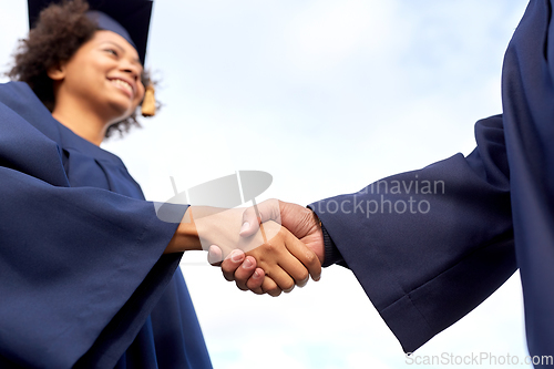 Image of graduate students or bachelors greeting each other