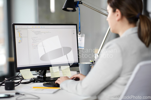 Image of businesswoman with computer working at office