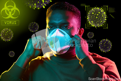 Image of african man in respirator protecting from virus