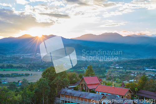 Image of Sunset landscape with mountain village