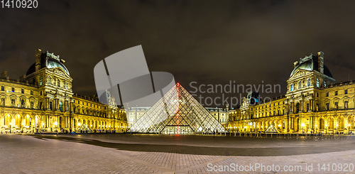 Image of The Louvre at night in Paris