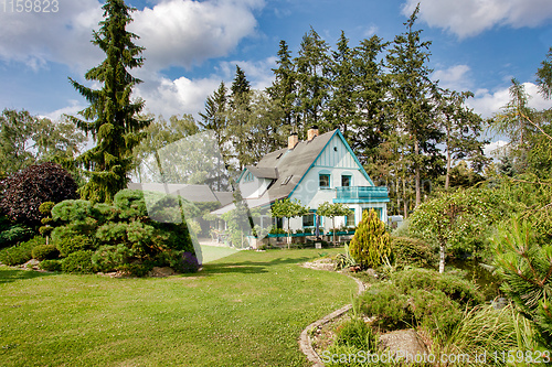 Image of Beautiful house in spring garden
